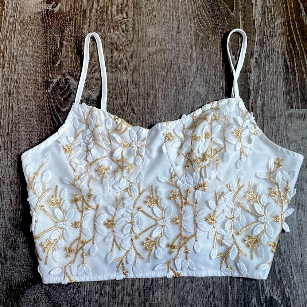I’m selling this gold and white tank top from SHEIN, in a size Large.